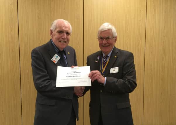Roy Joyner (left) receiving his certificate from Warwick Rotary Club President John Hibben.