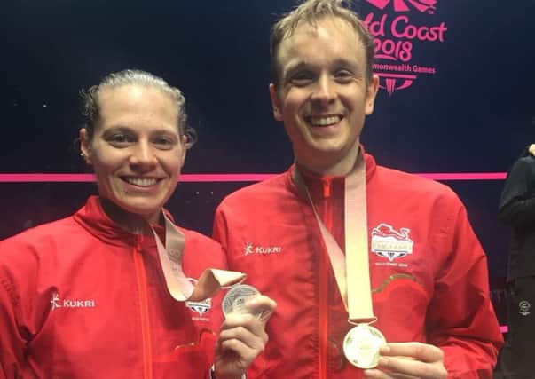 Sarah-Jane Perry shows off her silver medal with Team England gold medallist James Willstrop.