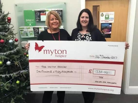 Louise Sheepy (right) with Louise Careless of Myton Hospice showing off the money raised from the last quiz held in December 2017.
