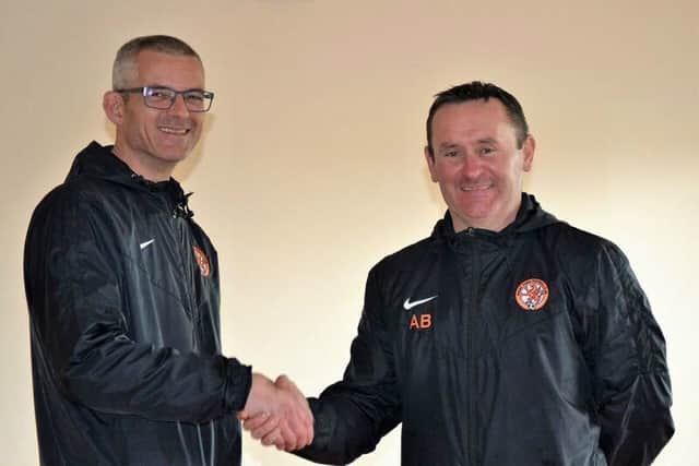 Jason Morris handing over to the new manager of Rugby Town Ladies, Allan Board