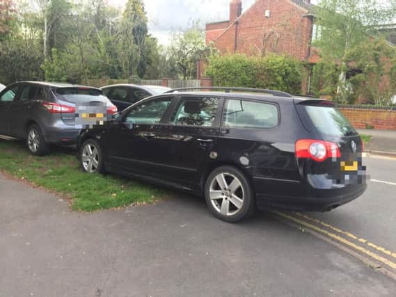 Cars parked on double yellow lines