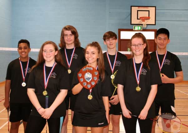 Rugby's Under 18s team with their trophy and gold medals