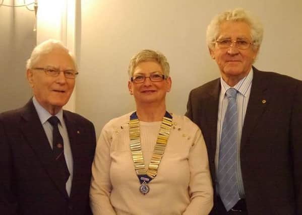 Warwick Lion's members Peter Amis (left) and Norman Winnett (right) with Club President Pauline Fanti.