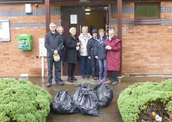 Members of the Hatton Park community helped recently cleaned up their community.