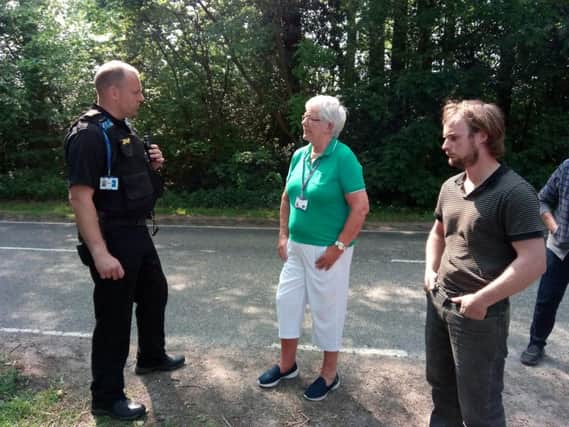 Pc Mark Finch of West Mercia Police speaking to Cllr Sue Gallagher and Joshua Tebby after the incident