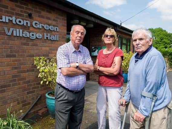 Burton Green will effectively be cut in half by HS2, and its village hall is among the buildings to be demolished. From left: Cllr Archie Taylor, chair of Burton Green Residents' Association Rona Taylor, and Cllr David Skinner.
