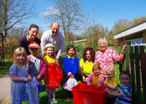 Left to right: Sarah Cleverley, early years educator; Vince Kilby, contract manager; Raj Kalsi, contract administrator and Councillor Moira Grainger with pupils from Warwick Nursery School.