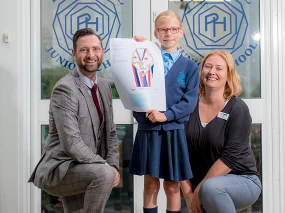 From left: Aaron Corsi from Warwickshire County Council, Beth Murray and headteacher of Park Hill Junior School, Lizzy Biggs, show off the winning design.