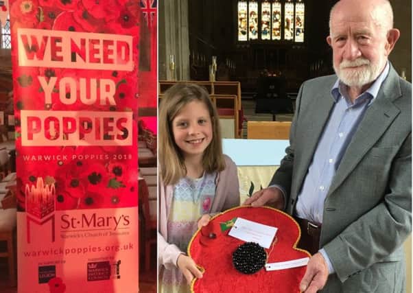 Isabella Robinson and her granddad Peter Lewis with their handmade poppy.