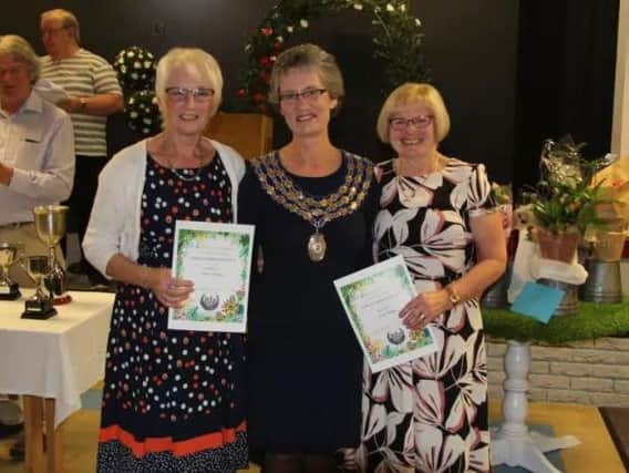 From left: Janet Phillips, Kenilworth mayor Cllr Kate Dickson and Diane Manders receiving Gold awards at last year's Kenilworth in Bloom awards night last year