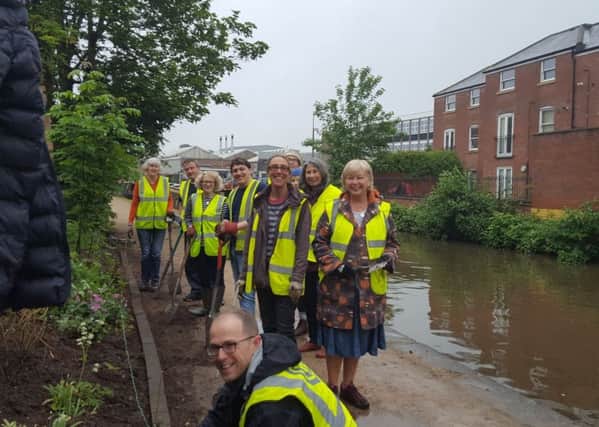 Volunteers and staff from Vitsoe clean up part of the Grand Union Canal towpath in Old Town.