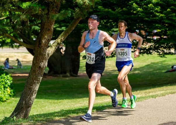 Alistair McDonnell and Andy Savery battle it out at the head of the field. Pictures: Mike Baker