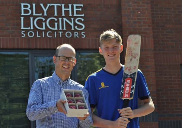 Kevin Mitchell, commercial solicitor and partner at Blythe Liggins, presents the balls to Dan Mousley.