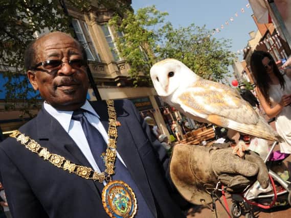 Mr Williams joined by Cody the British Barn Owl as he celebrates St George's day in 2011.