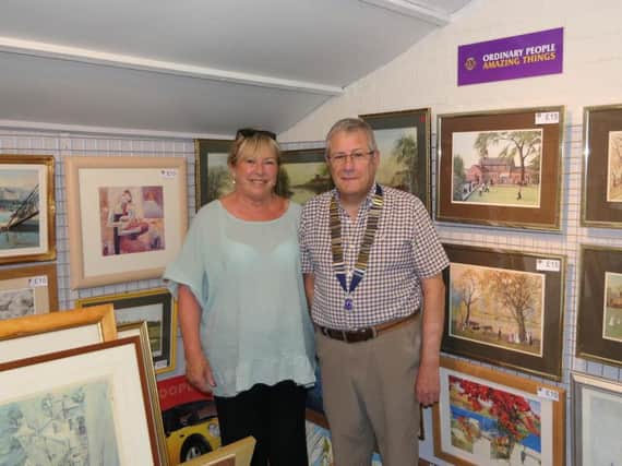 Cllr Pat Cain with Lions president Gordon Henderson in the furniture store's new picture gallery