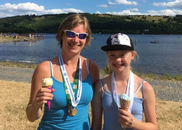 Rachel and Erin Lloyd enjoying a well-earned ice cream after their swims in Bala