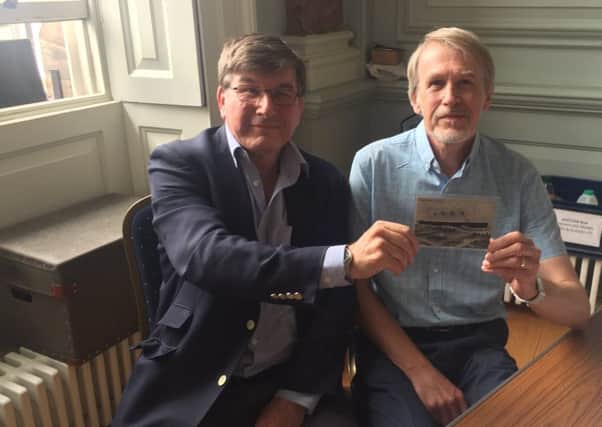 Ralph and Stephen Wilkes with the postcard.