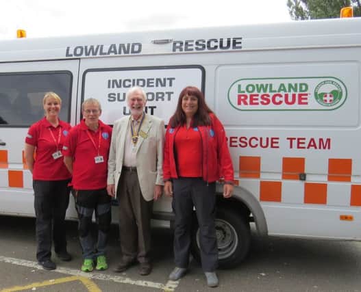 Warwick Rotary Club President David Smith with the Warwickshire Search and Rescue team.