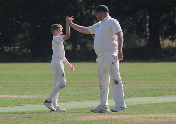 Wardens' Ben Blakemore is congratulated after taking the wicket of Steve Howe on his senior debut. Pictures: Morris Troughton