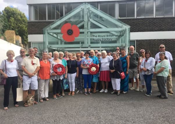 Members of the Warwick Poppies Project 2018 outside the poppy factory in Richmond.
