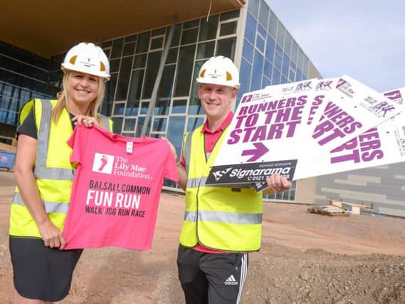 Lisa Dodd-Mayne (left) and Ryan Jackson (right) at the new University of Warwick
Sports and Wellness Hub, which is sponsoring the Balsall Common Fun Run