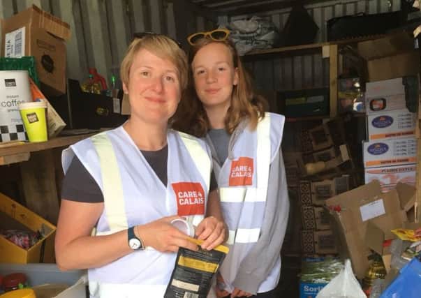 Emma Mort and her daughter Thea in one of the Care4Calais warehouses on a previous trip