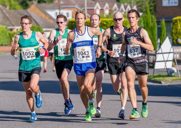 Andy Savery and Kenilworth Runners Connor Carson and Ben Taylor are prominent in the early stages. Pictures: Mike Baker