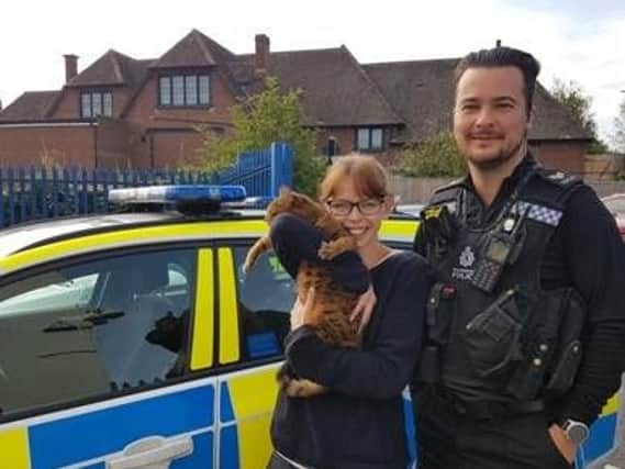 Anneke reunited with her cat Cookie and Sgt Chris Kitson. Photo by Warwick Safer Neighbourhood Team.
