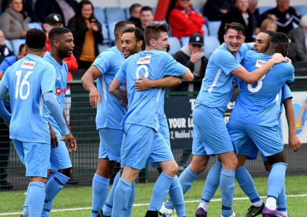 Rugby Town celebrate Charlie Evans' second goal to take the lead in the 90th minute  PICTURES BY MARTIN PULLEY