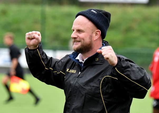 Manager Carl Adams celebrating Rugby Town's FA Cup win at Redditch    PICTURES BY MARTIN PULLEY