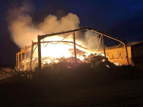 One of the barns on fire. Photo: Warwickshire Fire and Rescue Service