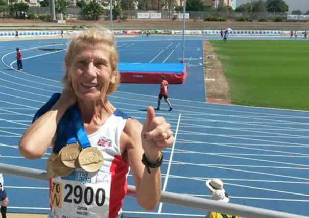 Angela Copson with her world masters medals in Malaga