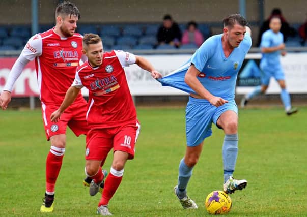 Scorer Richard Blythe dragged back in Saturday's FA Cup game   PICTURES BY MARTIN PULLEY