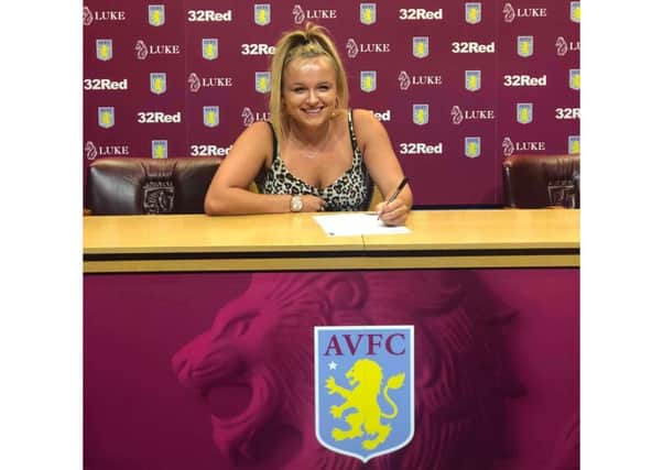 Millie Webb signing her one-year contract with Aston Villa