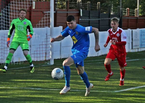 Leamington striker Matty Stenson chases down the ball in the Ashton box. Pictures: Sally Ellis