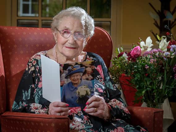 Mary Burdon with her card from The Queen.