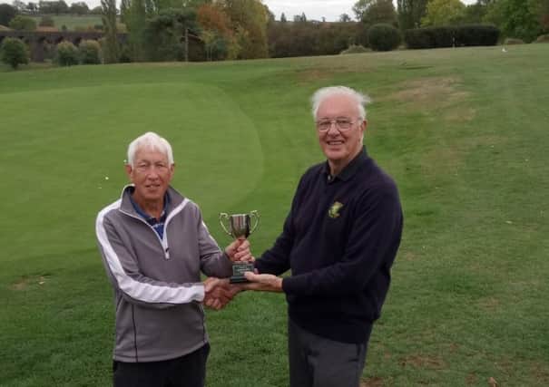 Seniors Captain Gordon Coulthard (right) presenting the TOFFs Trophy to Keith Oag