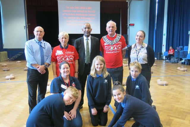 Kenilworth School's headteacher Hayden Abbott (back row, centre) with Year 8 pupils and CPR training volunteers including Kenilworth mayor Cllr Mike Hitchins (back row, second from right)