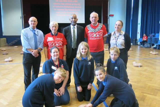 Kenilworth School's headteacher Hayden Abbott (back row, centre) with Year 8 pupils and CPR training volunteers including Kenilworth mayor Cllr Mike Hitchins (back row, second from right).