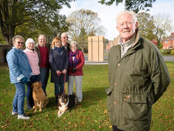 Pictured in front of the new war memorial in Long Itchington (L-R) are WARMLI members Rosie Reeve, Mary Heath, Colin Timms, Charlotte Griffin, Richard Reeve and Rhona Berry with chairman Dave Berry (front).