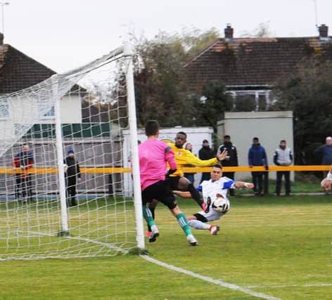 Trea Bertie bundles the ball home from close range to put Racing Club 4-0 up. Picture: Morris Troughton
