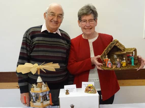 John and Marjorie Carrier with some of their nativity sets