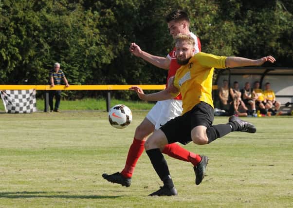 Rich Powell, seen here in action against Pegasus Juniors, opened the scoring for Racing Club