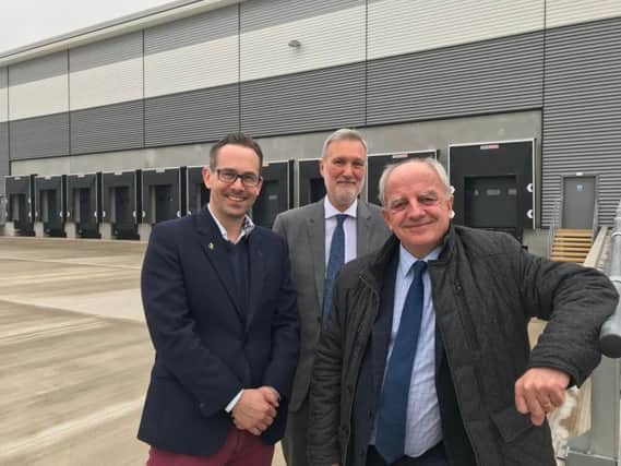 Pictured at the World of Books distribution centre World of Books Chief Financial and Operating Officer Graham Bell with Bill Hunt (Deputy Chief Executive Warwick District Council) and Cllr Andrew Mobbs (Leader Warwick District Council).
