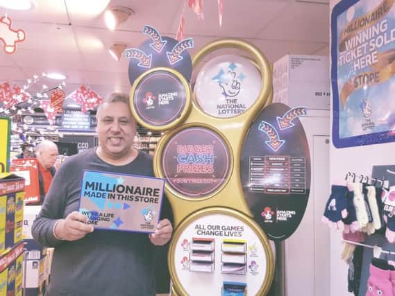 Sunder Sandher at the golden lottery playstation at his One Stop branch in Leamington.