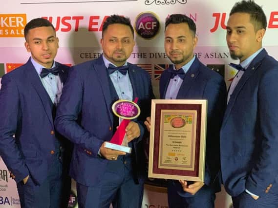 Mohammed Ahad and his brothers show off their awards at the Asian Curry Awards 2018.