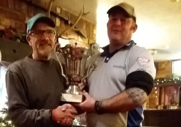 Kevin Folwell, holder for last five years, hands the Silver Fish trophy to new winner Jake King. (Kevin hasn't quite recovered after falling off a ladder a few weeks ago so couldn't take part this time)