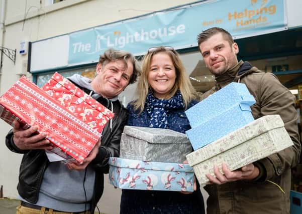 Lianne Kirkham and Staff at the 'Helping Hands' charity shop, are doing a shoe box appeal for the homeless.
Photo from 2017.

Pictured: Mark Jones, Lianne Kirkham and Arin Hartwell. NNL-171024-235445009