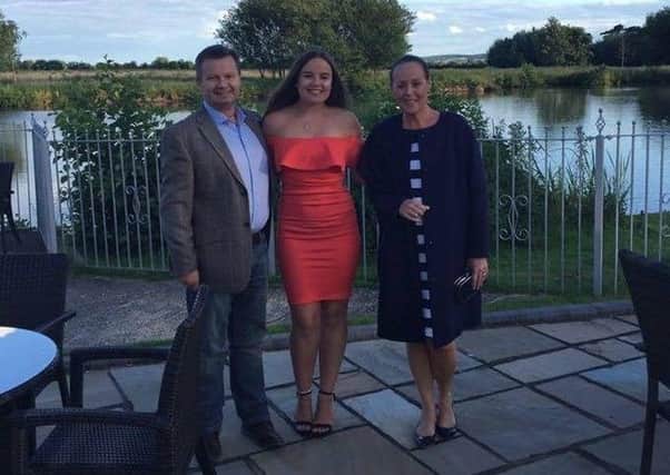 Elizabeth Skelton (centre) with her father Adrian and mother Karen.