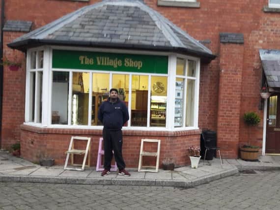Sukh Sangha, known as Ess, outside his shop in Hatton Park.